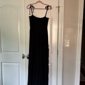 Black one piece wide leg jumpsuit with pockets